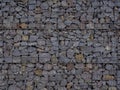 Decorative fence of bulk stone in the grid Royalty Free Stock Photo