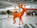 A decorative figure of an orange deer in the Karavan shopping mall in the Obolonsky district.