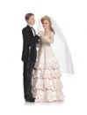 Bride and groom, old cake topper on white background Royalty Free Stock Photo