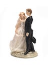 Bride and groom, old cake topper on white background Royalty Free Stock Photo