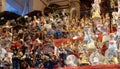 Decorative figurine on stall with decorations for winter holidays at traditional annual Christmas market in Zagreb