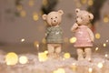 Decorative figurines of a Christmas theme. Figurines of cute teddy bears of a boy and a girl in sweaters with deers. Festive decor