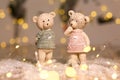 Decorative figurines of a Christmas theme. Figurines of cute teddy bears of a boy and a girl in sweaters with deers. Festive decor