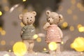 Decorative figurines of a Christmas theme. Figurines of cute teddy bears of a boy and a girl in sweaters with deers. Festive decor