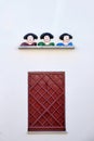 Decorative figurines of three bullfighters and a wooden window Royalty Free Stock Photo