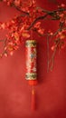 Decorative firecracker with background of ginkgo branch in chinese new year. Lunar New Year holidays