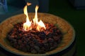 Decorative fireplace with pieces of cork placed on top of wooden wine barrel, displayed on Furniture And Living Expo