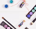 Decorative flat lay composition with makeup products, cosmetics and glass jars with decorative multi-colored stars. Flat Royalty Free Stock Photo