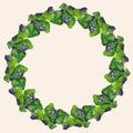 Decorative floral wreath from watercolor drawings of blooming purple flowers in green leaves