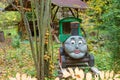 Decorative flowerbed in the form of a steam locomotive with a face