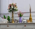 decorative flowers in the corner of the room