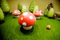 Decorative fly agaric on a green lawn.red mushrooms decoration.many mushrooms, big toys ,ornament.Fairy forest with