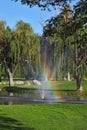Decorative fountain and shining rainbow Royalty Free Stock Photo