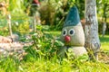 Decorative garden gnome in a house garden Royalty Free Stock Photo
