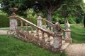Decorative garden steps with a balustrade, urns, & globes.