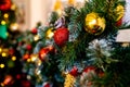 Decorative garland from christmas tree branches and cones. home decorated for winter holidays, little red and gold