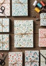 Decorative gift boxes adorned with floral patterns and tied with twine are arranged on Royalty Free Stock Photo