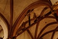 Decorative gilded ornamented baroque interior of church St. Henry and St. Kunhuty, crucifix and wood carvings of saints, stucco on