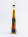 Decorative glass bottle artistic filled with oil and various grains