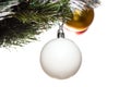 Decorative glass white, golden, and red ball ornaments on Christmas tree. Some balls and tree are blurred. Isolated on white Royalty Free Stock Photo