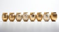 Decorative Golden Glass Jars with Elegant Designs on White Background