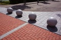 decorative granite balls spheres on sidewalk Royalty Free Stock Photo