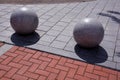 Decorative granite balls spheres on sidewalk Royalty Free Stock Photo