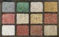 Decorative gravel samples for landscape design. Granules of gray marble, zeolite, white marble, pebble quartzite, cream marble, gr