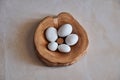 Sea Smoothed White Marble Pebbles in Wooden Bowl Royalty Free Stock Photo