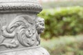 Decorative head column sculpture on a blurred background