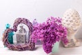 Decorative heart, lilac flowers and brigh lanterns on white wo