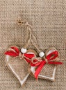 Decorative hearts on burlap background