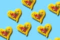 Decorative hearts of pasta on blue background