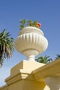 Decorative flowerpot on house wall roof, Spain