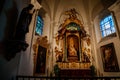 Decorative interior of church St. Henry and St. Kunhuty, Chapel of Virgin Mary, gilded ornamented baroque altar, marble statues,