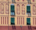 Decorative italian building facade with green shutters