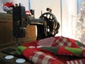 Decorative sewing machine with fabric. Royalty Free Stock Photo