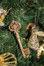 Decorative key and toys on Christmas tree Royalty Free Stock Photo