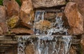 Decorative koi pond in a garden Royalty Free Stock Photo