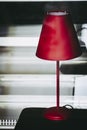 Decorative lamp for the home with a red shade Royalty Free Stock Photo