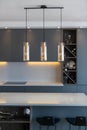 Decorative lamps hanging over kitchen island table