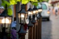 Decorative lanterns along the street cafe barrier. Royalty Free Stock Photo