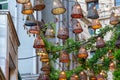 Decorative lanterns in wicker lamp shades hang on one of the streets of Istanbul