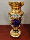 Decorative large painted ceramic vase on a wooden surface