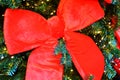 Decorative large red bows on the Christmas tree