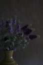 Decorative lilac bouquet on dark grey background
