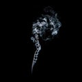 Decorative and magical white transparent smoke flowing elegant in a swirling soft movement isolated on black background Royalty Free Stock Photo