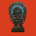a decorative mayan statuette isolated on a red background Royalty Free Stock Photo