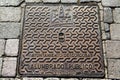 Decorative metal forged sewer hatch cover