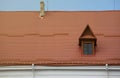 Decorative metal roof tiles in shape of old shingles. Type of roof of the house from a metal profile